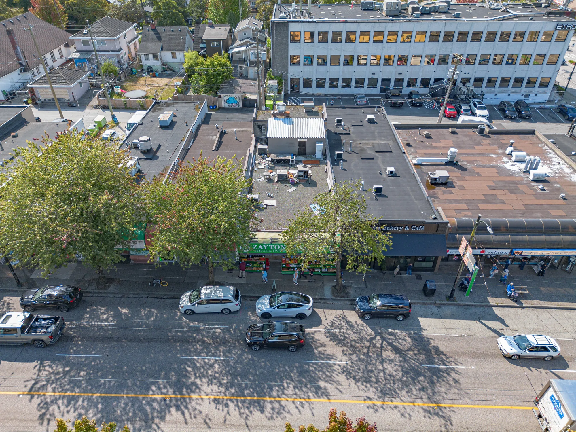Aerial of the block showing the retail strip and traffic on Hastings