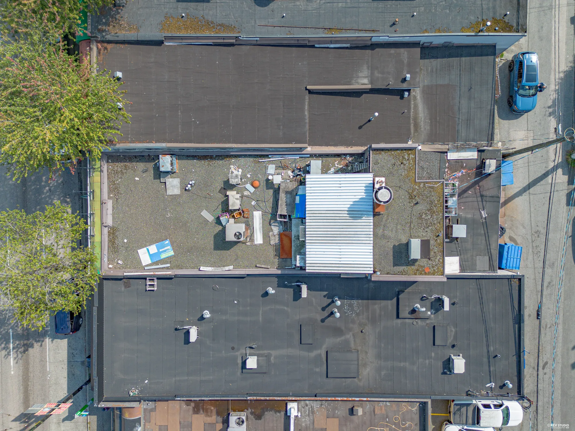 Top-down aerial of the building footprint and its flat roof