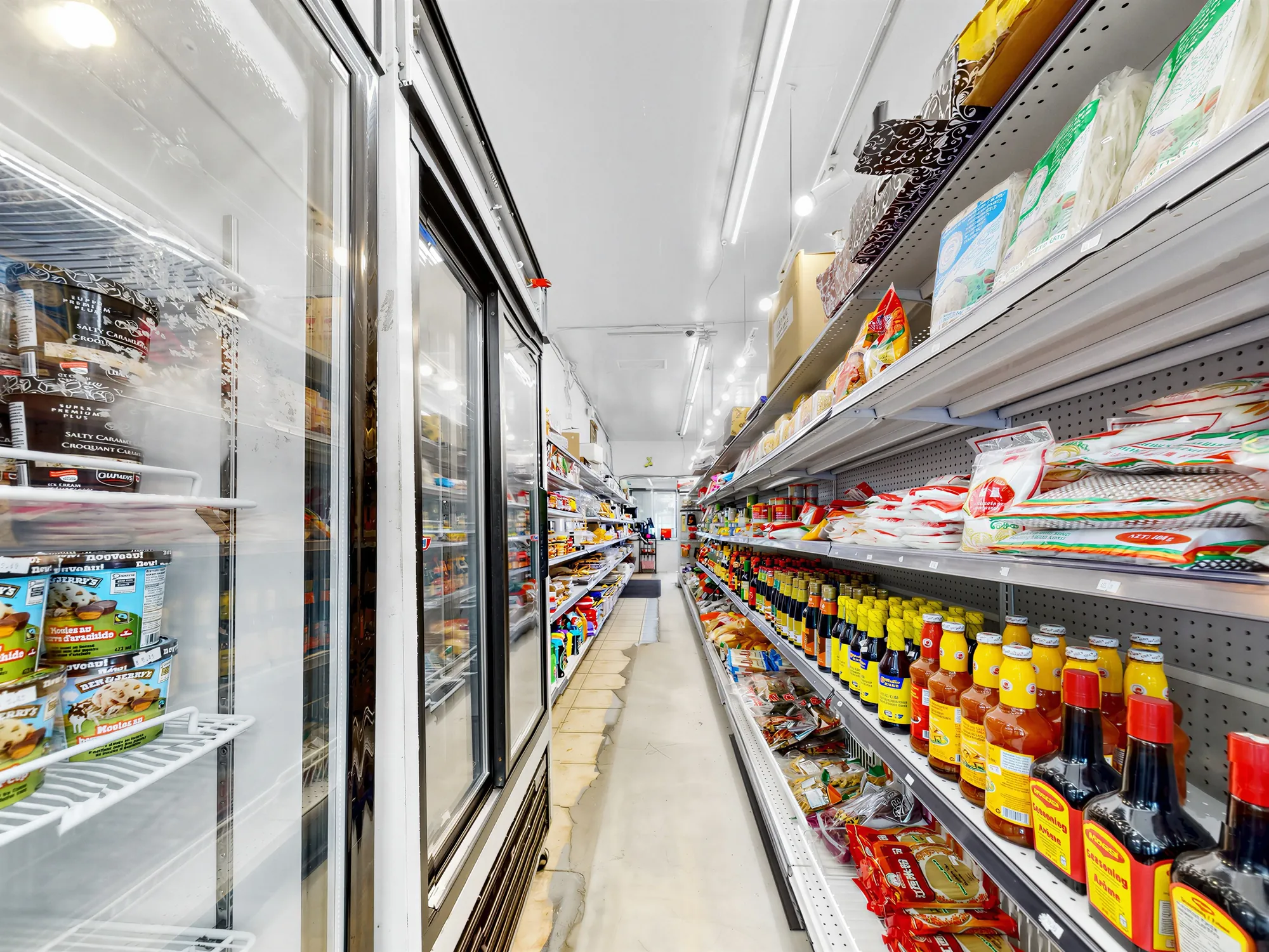 Upright glass-door coolers along the far wall