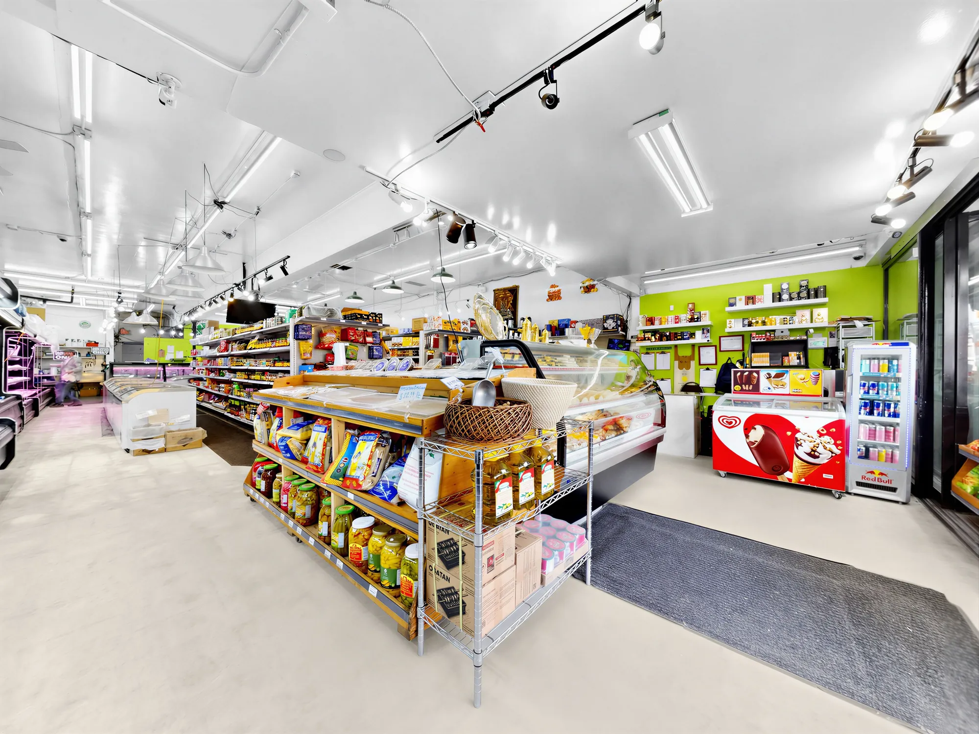 The shop floor from the entry, produce tables and aisles beyond