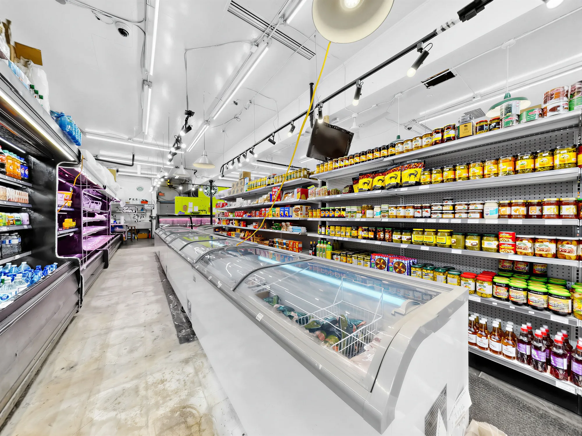 Dry goods shelving with a chest freezer run alongside