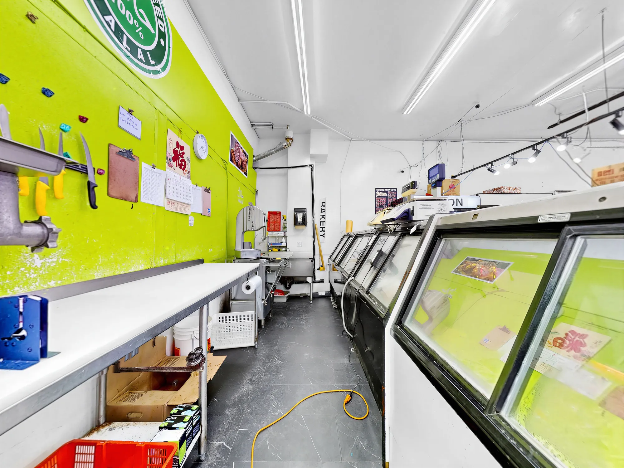 Long prep counter against the lime green wall