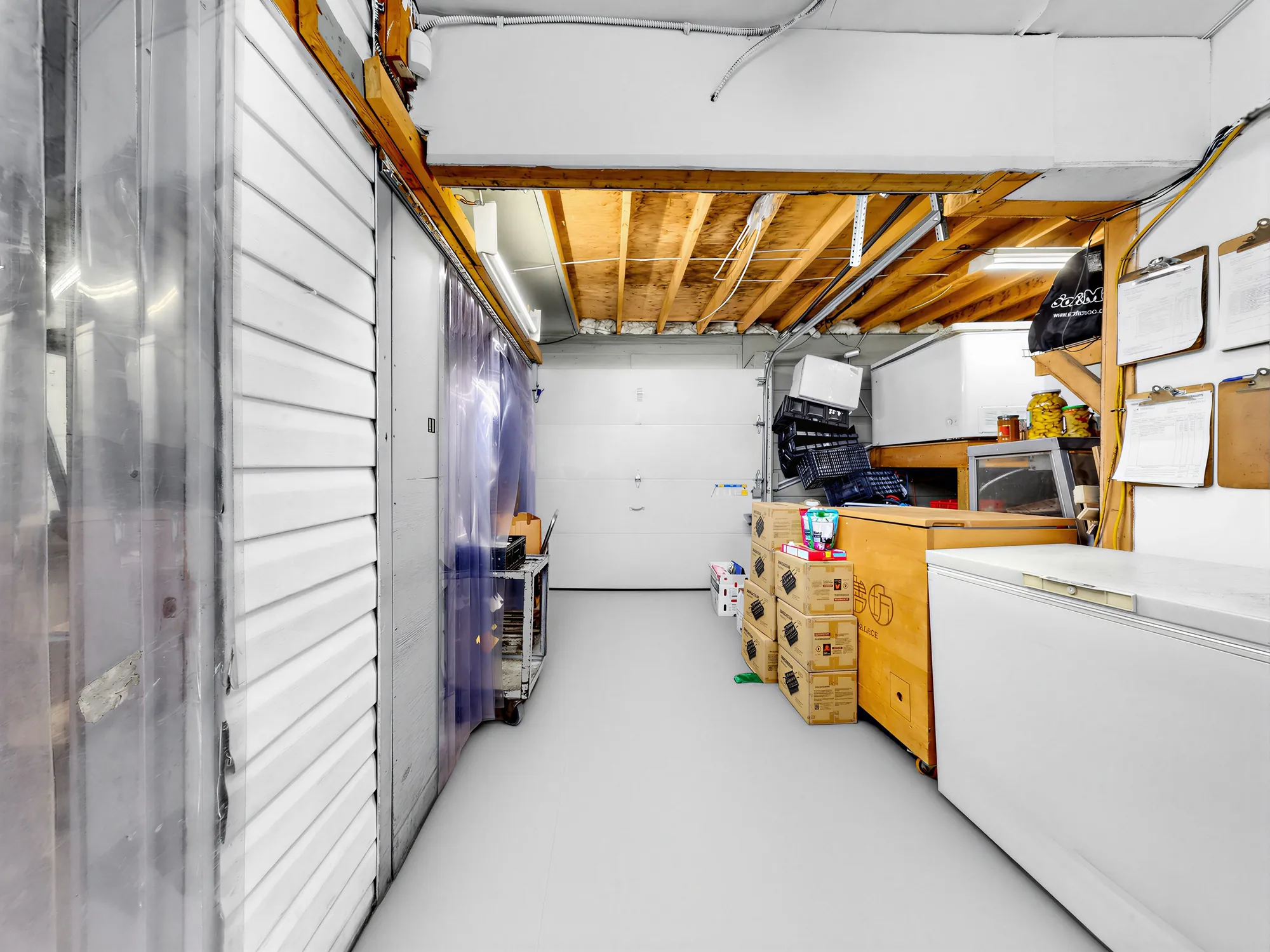 Strip-curtain entry to the walk-in cold storage